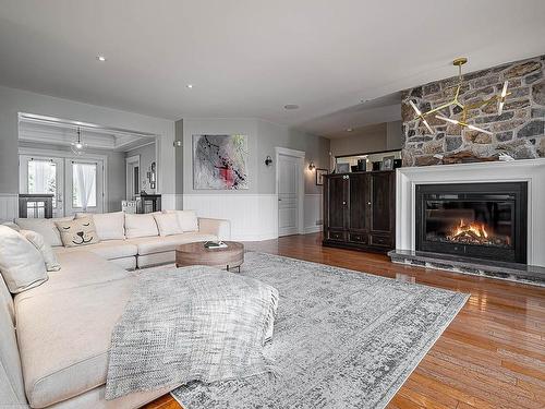 Living room - 138 Rue Du Havre, Terrebonne (Lachenaie), QC - Indoor Photo Showing Living Room With Fireplace