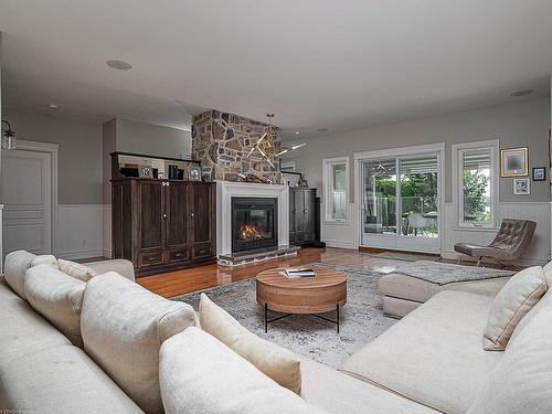 Family room - 138 Rue Du Havre, Terrebonne (Lachenaie), QC - Indoor Photo Showing Living Room With Fireplace