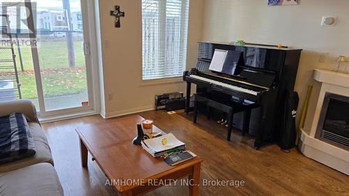 6 - 2 St Moritz Way, Markham, ON - Indoor Photo Showing Living Room With Fireplace