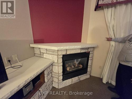 2132 - 90 Highland Drive, Oro-Medonte, ON - Indoor Photo Showing Living Room With Fireplace