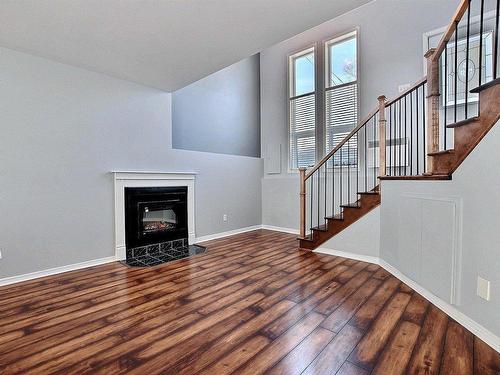 Living room - A-222 Rue Sandy, Sainte-Sophie, QC - Indoor With Fireplace