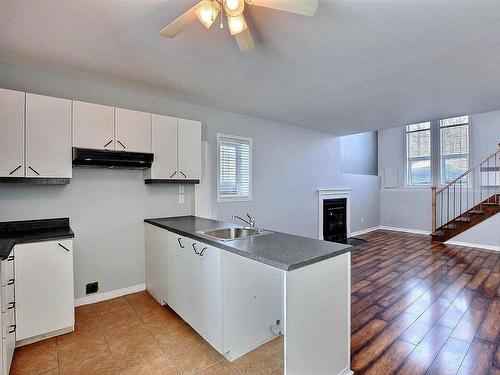 Kitchen - A-222 Rue Sandy, Sainte-Sophie, QC - Indoor Photo Showing Kitchen With Fireplace