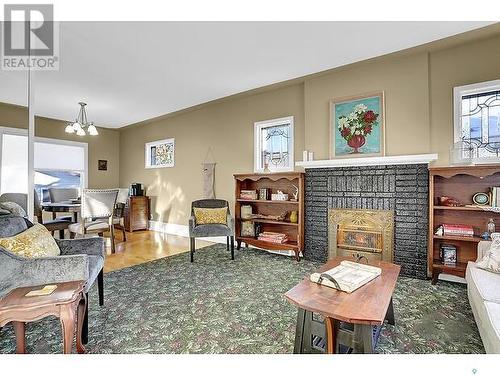 915 1St Avenue Ne, Moose Jaw, SK - Indoor Photo Showing Living Room With Fireplace