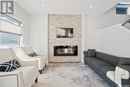 352 Brighton Gate, Saskatoon, SK - Indoor Photo Showing Living Room With Fireplace