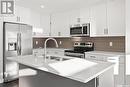 352 Brighton Gate, Saskatoon, SK  - Indoor Photo Showing Kitchen With Double Sink With Upgraded Kitchen 