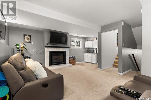 1110 Flexman Crescent N, Regina, SK - Indoor Photo Showing Living Room With Fireplace