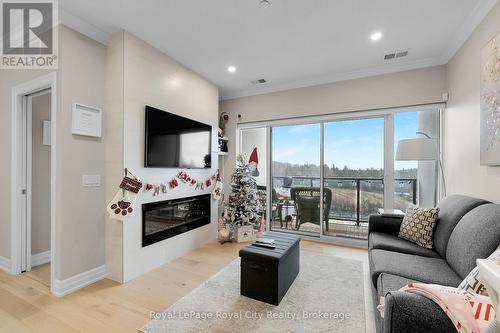 401 - 1880 Gordon Street, Guelph (Guelph South), ON - Indoor Photo Showing Living Room With Fireplace