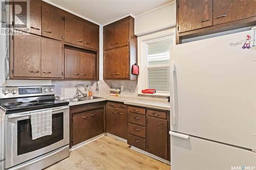 310 25Th Street W, Saskatoon, SK - Indoor Photo Showing Kitchen With Double Sink