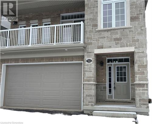 Doorway to property featuring a garage - 561 Balsam Poplar Street, Waterloo, ON - Outdoor With Balcony