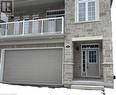 Doorway to property featuring a garage - 561 Balsam Poplar Street, Waterloo, ON  - Outdoor With Balcony 