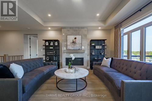 1065 Meadowlark Ridge, London, ON - Indoor Photo Showing Living Room With Fireplace