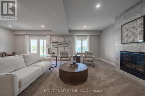 1065 Meadowlark Ridge, London, ON - Indoor Photo Showing Living Room With Fireplace