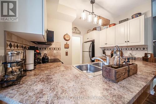 201 - 470 St Andrew Street E, Centre Wellington, ON - Indoor Photo Showing Kitchen With Double Sink