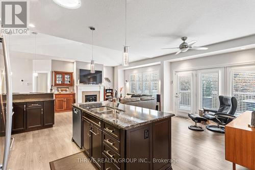 38 - 2295 Kains Road, London, ON - Indoor Photo Showing Kitchen With Fireplace With Double Sink