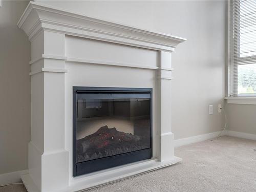 410-5670 Edgewater Lane, Nanaimo, BC - Indoor Photo Showing Living Room With Fireplace