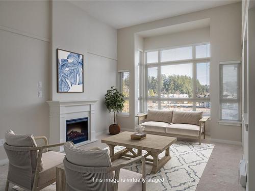 410-5670 Edgewater Lane, Nanaimo, BC - Indoor Photo Showing Living Room With Fireplace