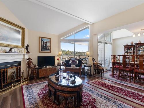 310-10459 Resthaven Dr, Sidney, BC - Indoor Photo Showing Living Room With Fireplace