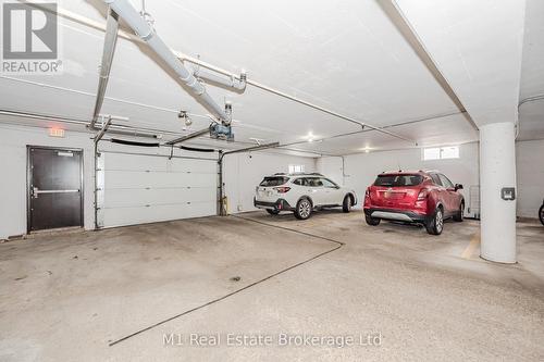 302 - 43 Caroline Street N, Waterloo, ON - Indoor Photo Showing Garage