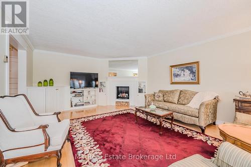 302 - 43 Caroline Street N, Waterloo, ON - Indoor Photo Showing Living Room With Fireplace