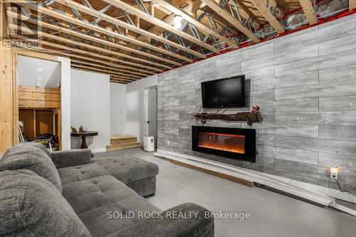 1410 Du Golf Road, Clarence-Rockland, ON - Indoor Photo Showing Basement With Fireplace