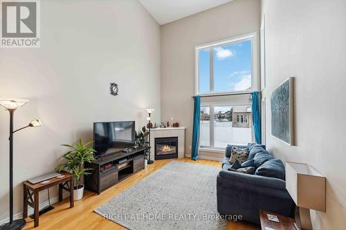 300 Cooks Mill Crescent, Ottawa, ON - Indoor Photo Showing Living Room With Fireplace