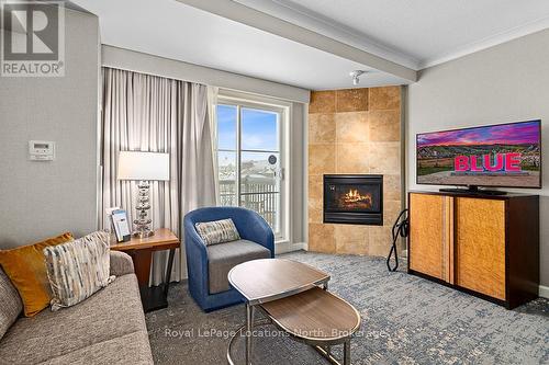 344 - 220 Gord Canning Drive, Blue Mountains (Blue Mountain Resort Area), ON - Indoor Photo Showing Living Room With Fireplace