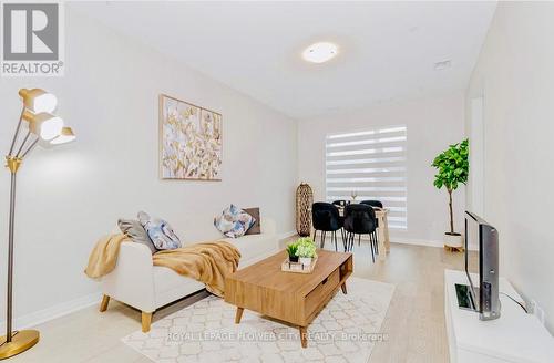 203 - 460 Gordon Krantz Avenue, Milton, ON - Indoor Photo Showing Living Room