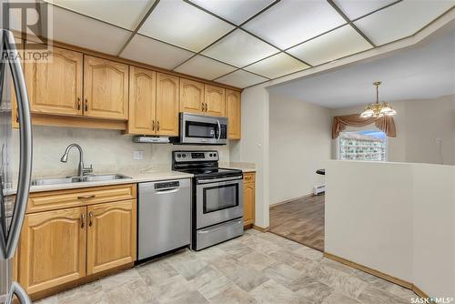 337 2301 Adelaide Street E, Saskatoon, SK - Indoor Photo Showing Kitchen With Stainless Steel Kitchen With Double Sink