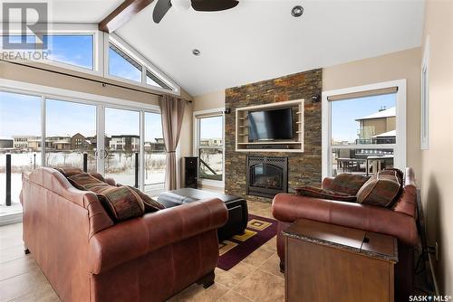 4128 Green Willow Terrace, Regina, SK - Indoor Photo Showing Living Room With Fireplace