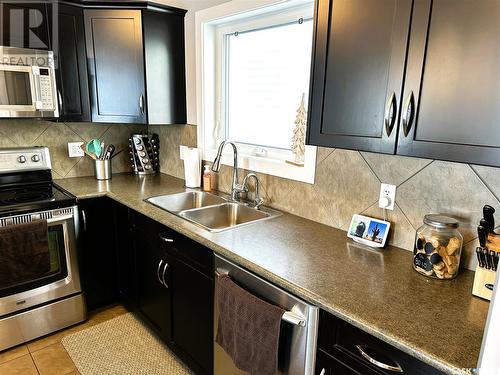 7524 Oxbow Way, Regina, SK - Indoor Photo Showing Kitchen With Double Sink