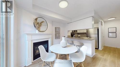 1019 - 18 Laidlaw Street, Toronto, ON - Indoor Photo Showing Dining Room With Fireplace