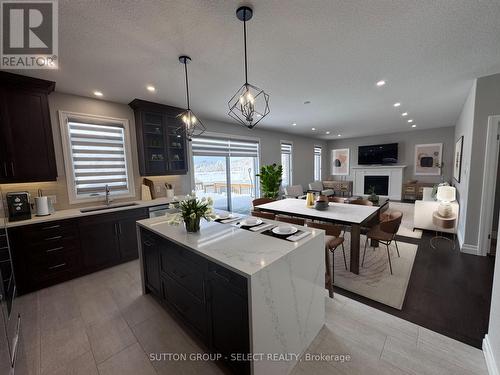 IRTUALLY STAGED - 123 Foxborough Place, Thames Centre (Thorndale), ON - Indoor Photo Showing Kitchen With Upgraded Kitchen