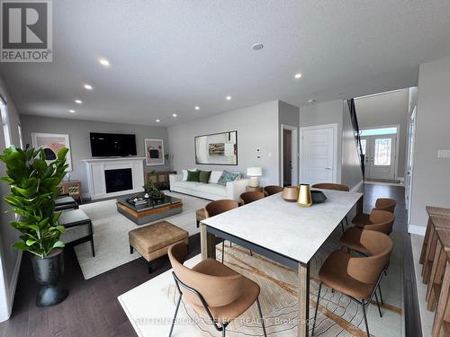 VIRTUALLY STAGED - 123 Foxborough Place, Thames Centre (Thorndale), ON - Indoor Photo Showing Living Room With Fireplace