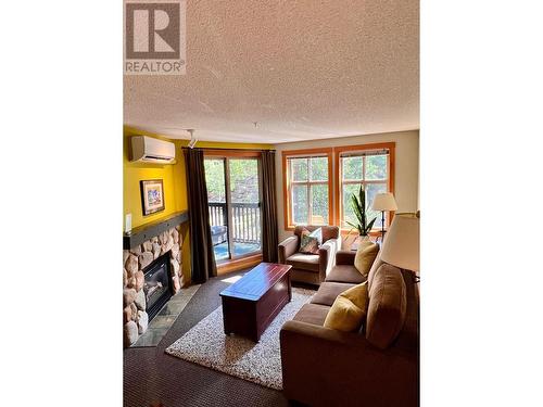 2060 Summit Drive Unit# 313, Panorama, BC - Indoor Photo Showing Living Room With Fireplace