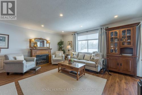 208 - 90 King Street E, Kawartha Lakes, ON - Indoor Photo Showing Living Room With Fireplace