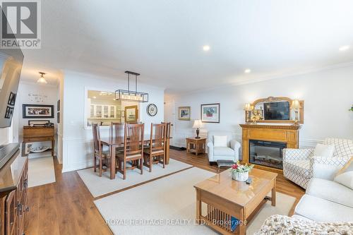 208 - 90 King Street E, Kawartha Lakes, ON - Indoor Photo Showing Living Room With Fireplace