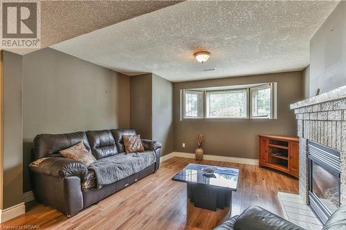 Family room - 46 Hodgins Crescent, Woodstock, ON - Indoor Photo Showing Living Room With Fireplace