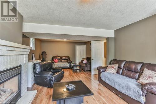 46 Hodgins Crescent, Woodstock, ON - Indoor Photo Showing Living Room With Fireplace