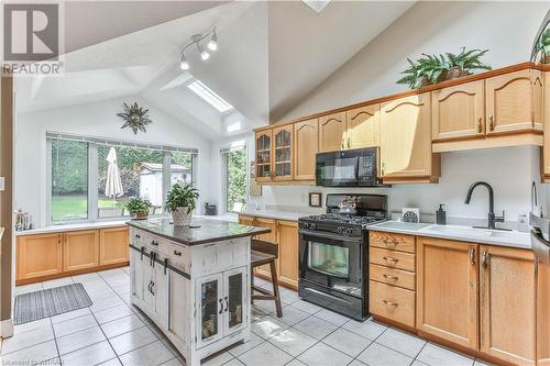 Kitchen with a center island, lofted ceiling - 46 Hodgins Crescent, Woodstock, ON - Indoor Photo Showing Kitchen