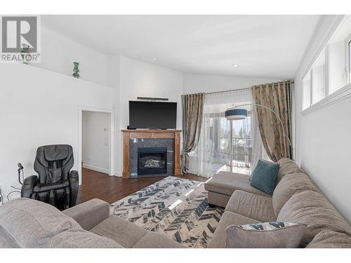 374 Trumpeter Court, Kelowna, BC - Indoor Photo Showing Living Room With Fireplace