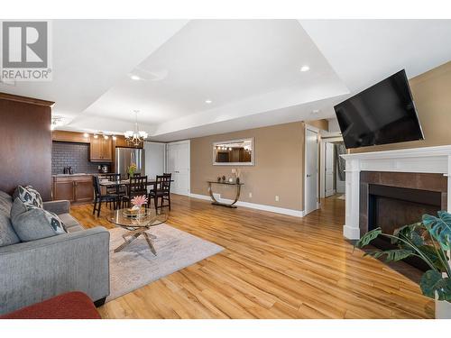 374 Trumpeter Court, Kelowna, BC - Indoor Photo Showing Living Room With Fireplace