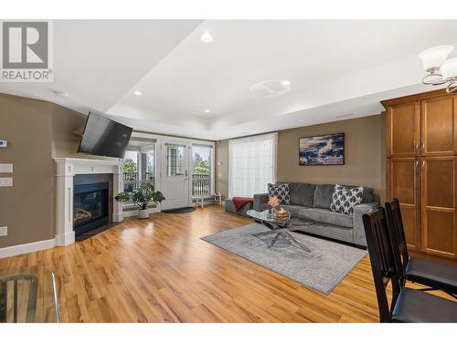 374 Trumpeter Court, Kelowna, BC - Indoor Photo Showing Living Room With Fireplace