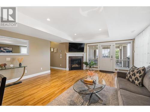 374 Trumpeter Court, Kelowna, BC - Indoor Photo Showing Living Room With Fireplace