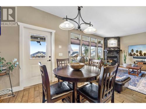 338 Prestwick Lane, Kelowna, BC - Indoor Photo Showing Dining Room With Fireplace