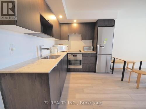 306 - 225 Village Green Square, Toronto, ON - Indoor Photo Showing Kitchen