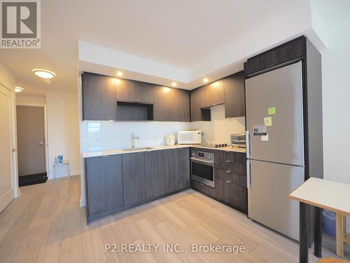 306 - 225 Village Green Square, Toronto, ON - Indoor Photo Showing Kitchen