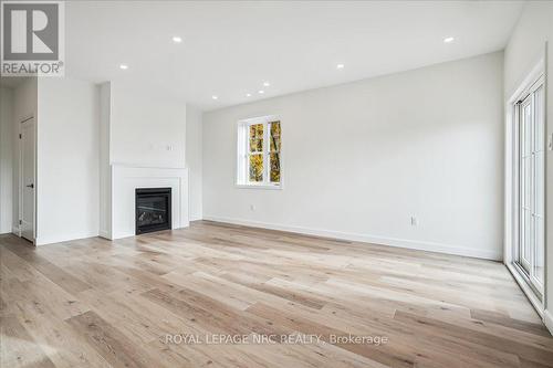 1 - 29 Cyclone Way, Fort Erie (337 - Crystal Beach), ON - Indoor Photo Showing Living Room With Fireplace