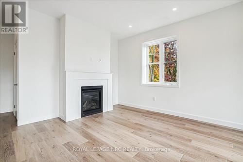 1 - 29 Cyclone Way, Fort Erie (337 - Crystal Beach), ON - Indoor Photo Showing Living Room With Fireplace