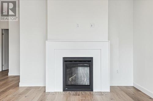 1 - 29 Cyclone Way, Fort Erie (337 - Crystal Beach), ON - Indoor Photo Showing Living Room With Fireplace