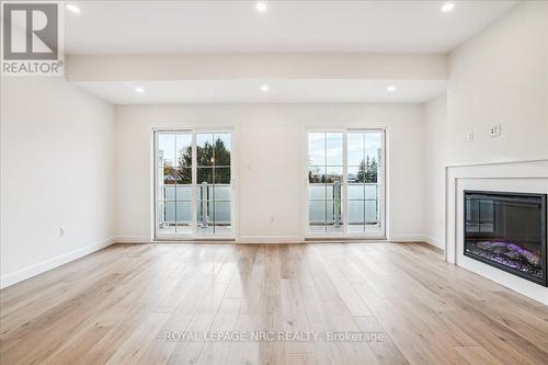 2 - 29 Cyclone Way, Fort Erie (337 - Crystal Beach), ON - Indoor Photo Showing Living Room With Fireplace